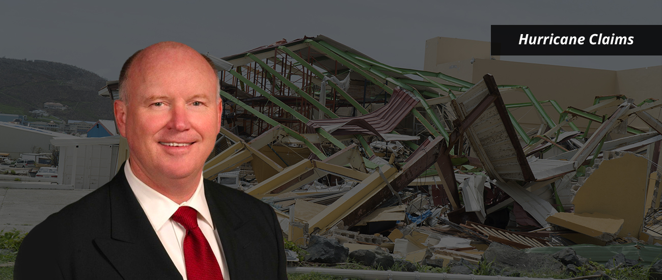 Tom Thornhill with a photo featuring a slightly dark filter, showcasing a destroyed house in the background.