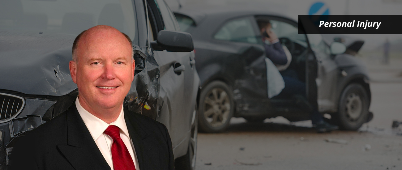 Tom Thornhill with a photo featuring a slightly dark filter, showcasing a car crash in the background.